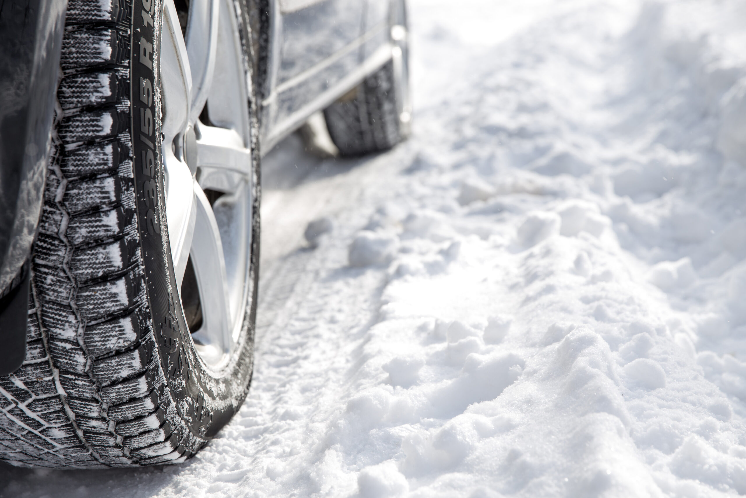 close up tyre image on a snow filled road during winter