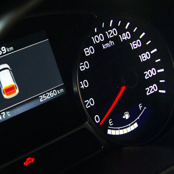 Car dashboard displaying a speed limit meter.